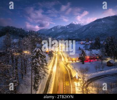 An aerial view of a snowy forest and highway Stock Photo - Alamy