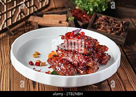 Braised（bake） pork rib in Brown Sauce en clay pot or Casserole, sweet and sour pork ribs Stock Photo