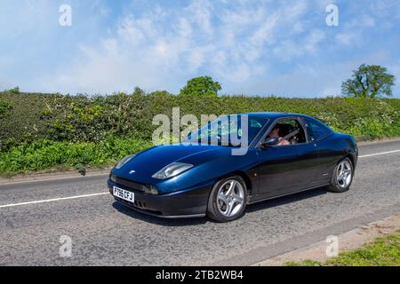1997 90s nineties Black Italian FIAT Coupe 5 Speed Manual 1998 cc car, 2.0 litre, five-cylinder 20V; Vintage, restored classic motors, automobile collectors motoring enthusiasts, historic veteran cars travelling in Cheshire, UK Stock Photo