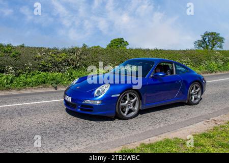 PDK 2009 Aqua Blue metallic Porsche 911 Carrera S  RWD 6 CYL 3.8L horizontally opposed six-cylinder engine; Vintage, restored classic motors, automobile collectors motoring enthusiasts, historic veteran cars travelling in Cheshire, UK Stock Photo