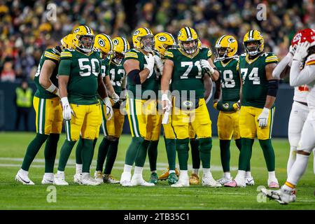 Green Bay, Wisconsin, USA. 3rd Dec, 2023. Green Bay Packers guard Zach Tom (50), guard Jon Runyan (76), center Josh Myers (71), guard Elgton Jenkins (74), and the Packer offense during the NFL football game between the Kansas City Chiefs and the Green Bay Packers at Lambeau Field in Green Bay, Wisconsin. Darren Lee/CSM/Alamy Live News Stock Photo