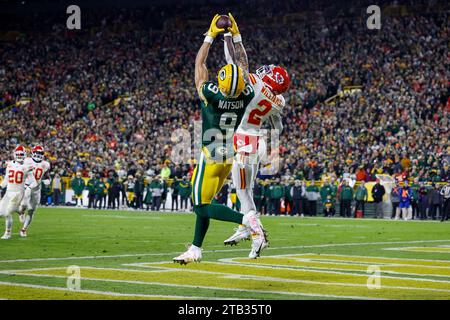 Green Bay, Wisconsin, USA. 3rd Dec, 2023. Green Bay Packers wide receiver Christian Watson (9) with a 12 yard touchdown catch over Kansas City Chiefs cornerback Joshua Williams (2) during the NFL football game between the Kansas City Chiefs and the Green Bay Packers at Lambeau Field in Green Bay, Wisconsin. Darren Lee/CSM/Alamy Live News Stock Photo