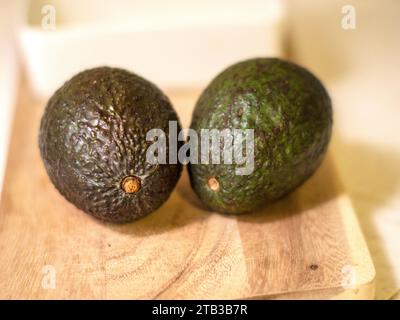 Avocados on the cutting board Stock Photo