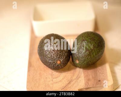 Avocados on the cutting board Stock Photo