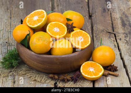 fresh tangerines in a bowl on old wooden background Stock Photo