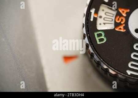 Shutter speed dial of an old film camera set to bulb mode, macro close up. Stock Photo