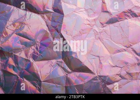 Iridescent holographic textural Background. Wrinkled folded paper or foil with iridescent highlights Stock Photo