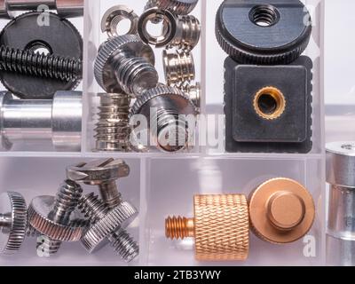 A box with accessories for mounting various equipment for photo and video shooting. Flat layer. Close up. Stock Photo