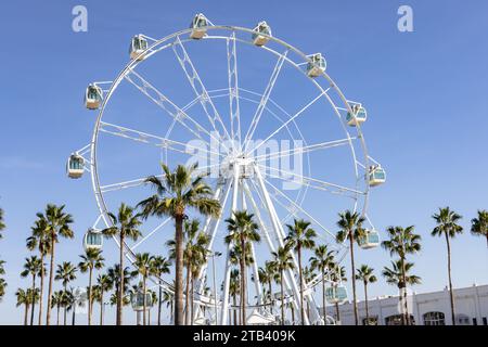Benalmádena, Spain - November 25, 2023: Giant Ferris Wheel Mirador Princess, Panoramic viewpoint between palm trees in Puerto Marina, Benalmadena, Mal Stock Photo