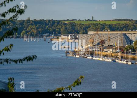 The buildings of Chatham Maritime Museum and the river Medway, from Victoria Gardens Rochester Stock Photo