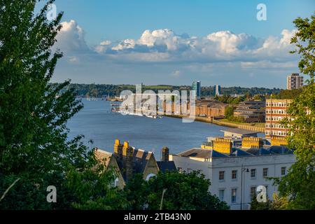 The buildings of Chatham Maritime Museum and the river Medway, from Victoria Gardens Rochester Stock Photo