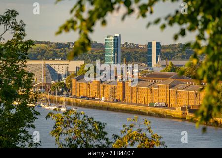 The buildings of Chatham Maritime Museum and the river Medway, from Victoria Gardens Rochester Stock Photo