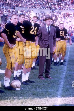 WEST POINT, NY - OCTOBER 4: Head coach Earl 'Red' Blaik, Pete Dawkins #24 and Harry Walters #33 of the Army Cadets stand on the sideline during an NCAA game against the Penn State Nittany Lions on October 4, 1958 at Michie Stadium in West Point, New York. The Cadets defeated the Nittany Lions 26-0. (Photo by Hy Peskin) *** Local Caption *** Earl Blaik;Pete Dawkins;Harry Walters Stock Photo