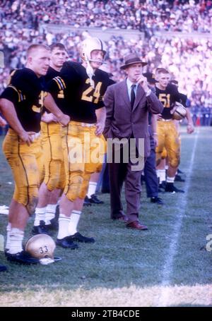 WEST POINT, NY - OCTOBER 4: Head coach Earl 'Red' Blaik, Pete Dawkins #24 and Harry Walters #33 of the Army Cadets stand on the sideline during an NCAA game against the Penn State Nittany Lions on October 4, 1958 at Michie Stadium in West Point, New York. The Cadets defeated the Nittany Lions 26-0. (Photo by Hy Peskin) *** Local Caption *** Earl Blaik;Pete Dawkins;Harry Walters Stock Photo