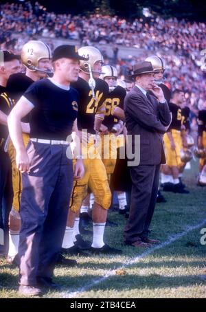 WEST POINT, NY - OCTOBER 4: Head coach Earl 'Red' Blaik, Pete Dawkins #24 and quarterback Joe Caldwell #12 of the Army Cadets stand on the sideline during an NCAA game against the Penn State Nittany Lions on October 4, 1958 at Michie Stadium in West Point, New York. The Cadets defeated the Nittany Lions 26-0. (Photo by Hy Peskin) *** Local Caption *** Earl Blaik;Pete Dawkins;Joe Caldwell Stock Photo