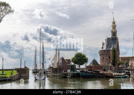 Panoramic view over inner harbor of Hoorn in the Netherlands towards outer harbor with modern and traditional boats, historic buildings, main defense Stock Photo