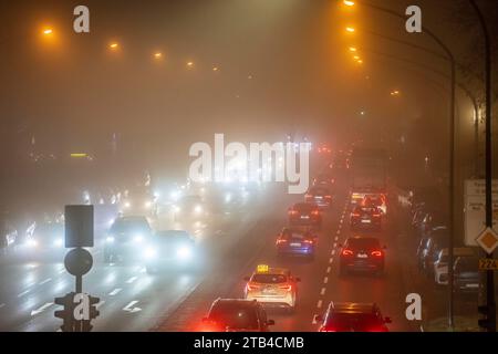 City centre traffic, fog, traffic jam, autumn, winter, evening rush hour traffic, Alfredstraße B224, Essen, NRW, Germany, Stock Photo