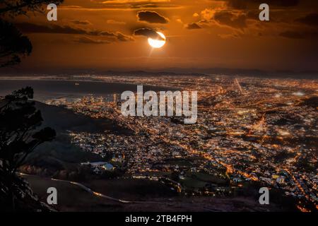 aerial view night Cape town, waterfront and the ocean, city lights are on Stock Photo