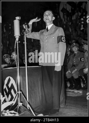 GOEBBELS 1930's Joseph Goebbels at a political rally giving the Nazi salute He was an infamous leading propaganda strategist Nazi, Joseph Goebbels wearing military uniform with swastika armband at a Nazi rally in the 1930s Stock Photo