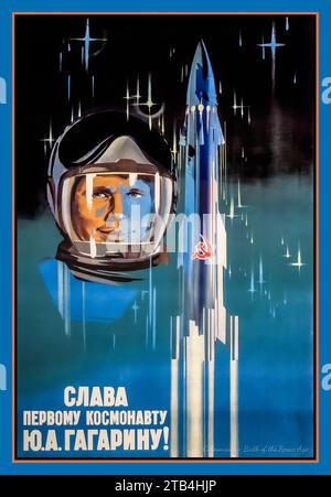 YURI GAGARIN Vintage 1960's USSR Soviet Russian Space Race Propaganda Poster 'GLORY TO THE FIRST COSMONAUR YURI GAGARIN '  Cosmonauts Birth of The Space Age featuring the first  successful man in space Yuri Gagarin. Rocket features the Soviet USSR symbol 1961 Russian Soviet USSR symbol 1961 Stock Photo