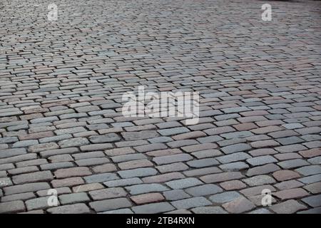 Street sidewalk texture in tile. Gray rectangular tile in perspective. Background. Horizontal. Stock Photo