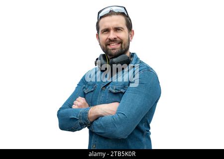 Young caucasian latin man using safety gear, glasses and hearing protection. Industrial safety concept. Stock Photo