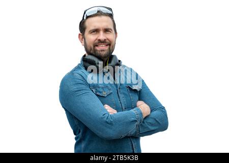 Young caucasian latin man using safety gear, glasses and hearing protection. Industrial safety concept. Stock Photo
