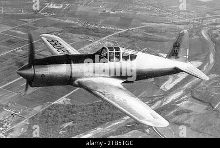 Vultee P-66 Vanguard, Model 48 in flight with original long nose cowling 061024-F-1234P-029. Stock Photo