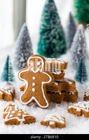 Holiday shaped gingerbread cookies with a gingerbread man in front. Stock Photo