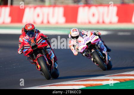 Cheste, Spain. 24th Nov, 2023. Francesco Bagnaia of Italy and Ducati Lenovo Team (L) and Jorge Martin of Spain and Prima Pramac Racing (R) rides during the Practice session of the MotoGP Gran Premio Motul de la Comunitat Valenciana at Ricardo Tormo Circuit (Cheste, Practice session of the MotoGP Gran Premio Motul de la Comunitat Valenciana). (Photo by Vicente Vidal Fernandez/SOPA Images/Sipa USA) Credit: Sipa USA/Alamy Live News Stock Photo