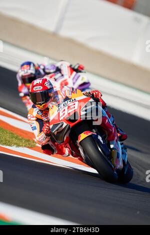 Cheste, Spain. 24th Nov, 2023. Marc Marquez of Spain and Repsol Honda Team (Front) and Johan Zarco of France and Prima Pramac Racing (Behind) ride during the Practice session of the MotoGP Gran Premio Motul de la Comunitat Valenciana at Ricardo Tormo Circuit (Cheste, Practice session of the MotoGP Gran Premio Motul de la Comunitat Valenciana). (Photo by Vicente Vidal Fernandez/SOPA Images/Sipa USA) Credit: Sipa USA/Alamy Live News Stock Photo