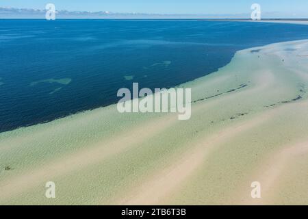 Aerial view of pools of water on a white sandy beach formed in long lines and ripples at Moonta Bay on the Yorke Peninsula in South Australia Stock Photo