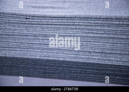 Stacked folded  Gray fabric Surface Texture Background Wallpaper Stock Photo