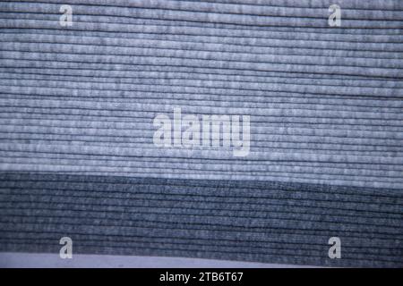 Stacked folded  Gray fabric Surface Texture Background Wallpaper Stock Photo