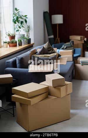 Vertical image of large room with packed boxes during move Stock Photo