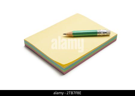 Block of colored sticky notes with a green pencil Stock Photo