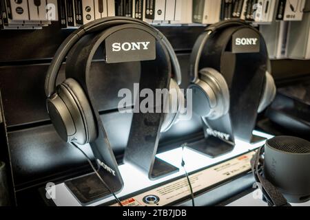 LONDON- NOVEMBER 30, 2023: Sony headphones for sale on display stand inside HMV on Oxford Street Stock Photo