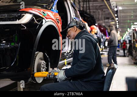 United States, California, Fremont: worker on the assembly line at the Tesla car factory. Courtesy of Tesla, Inc. Stock Photo