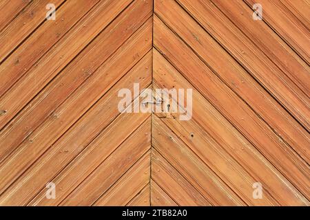 Old metal latch on wooden barn door as wood background texture Stock Photo