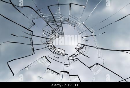 Texture of broken window. Hole in the window glass. Stock Photo