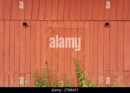 Old red painted wooden barn as wood background texture Stock Photo