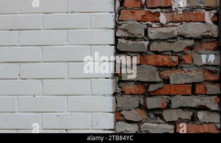 Texture Of Painted In White Brickwork And Rough Brickwork Separated In Center Of Image Stock Photo