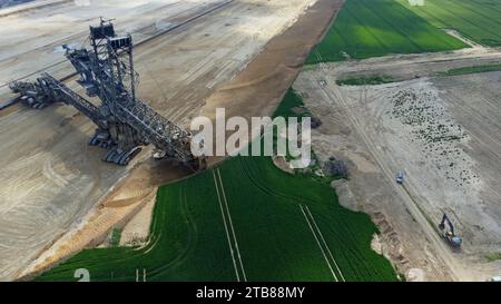 Aerial drone view of giant excavator at the Garzweiler II opencast lignite brown coal mine, Dusseldorf, Germany, May 2023 Stock Photo