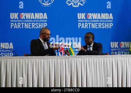 Home Secretary James Cleverly and Rwandan Minister of Foreign Affairs Vincent Biruta sign a new treaty. The treaty will address concerns by the Supreme Court, including assurances that Rwanda will not remove anybody transferred under the partnership to another country. Picture date: Tuesday December 5, 2023. Stock Photo