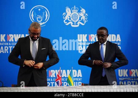 Home Secretary James Cleverly and Rwandan Minister of Foreign Affairs Vincent Biruta sign a new treaty. The treaty will address concerns by the Supreme Court, including assurances that Rwanda will not remove anybody transferred under the partnership to another country. Picture date: Tuesday December 5, 2023. Stock Photo