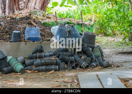 Heap of waste garbage dump with pots and leaves of dried plants in rural areas of agro-industrial complex Stock Photo