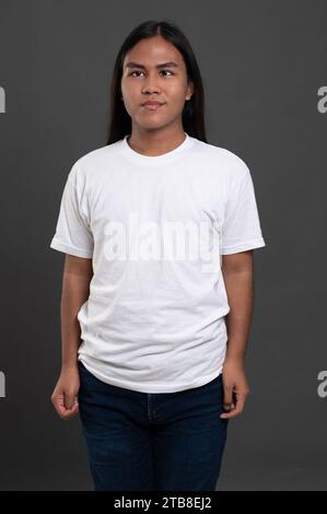 Portrait of young man native american isolated on grey studio background Stock Photo