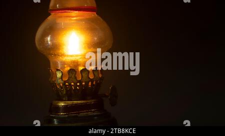 Old vintage kerosene black lamp isolated on black background with copy space Stock Photo