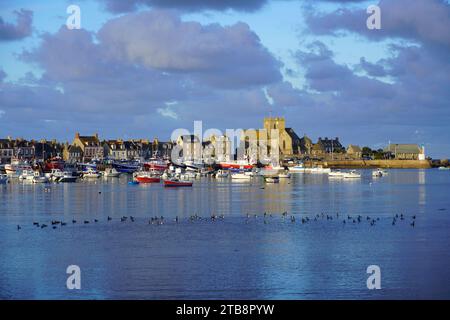 Barfleur (Normandy, north-western France): the small village and its fishing port. St. Nicholas’ Church( “eglise Saint-Nicolas”) registered as a Natio Stock Photo