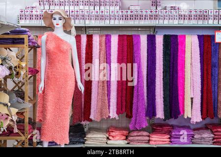 DA NANG CITY-VIETNAM, OCTOBER 14, 2023:Variety of Beautiful colorful cloth made from bamboo pulp for good health hanging for sale with mannequin weari Stock Photo